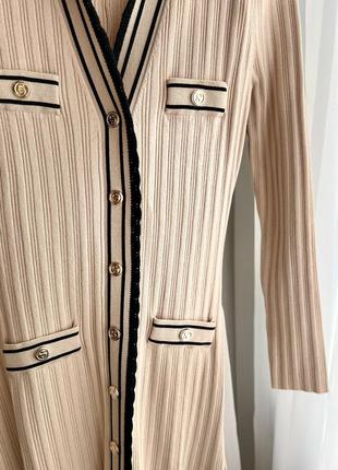 Бежева світла персикова трикотажна довга сукня клеш з довгим рукавом sandro