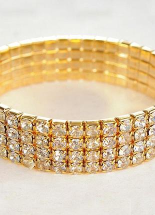 Браслет на резинці чотирирядний стрази жовті обхват 16-17 см