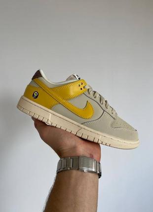 Женские кроссовки серые с желтым nike dunk low lx banana