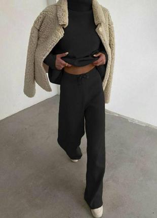 Женский теплый прогулочный костюм с брюками клеш5 фото