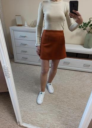 Юбка мини трапецией с накладными карманами