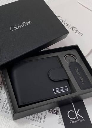 Кошелек мужской кожаный на кнопке черный calvin klein подарочный набор из натуральной кожи кошелек и брелок2 фото