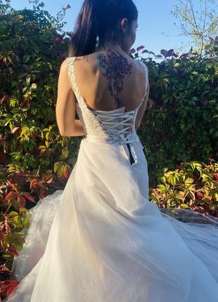 Полная распродажа. свадебное платье со шлейфом.1 фото