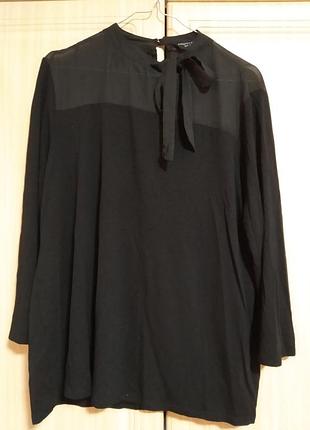 Нарядная трикотажная блуза с ассиметричным бантом