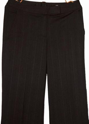 Стильные черные брюки-бермуды свободного фасона3 фото
