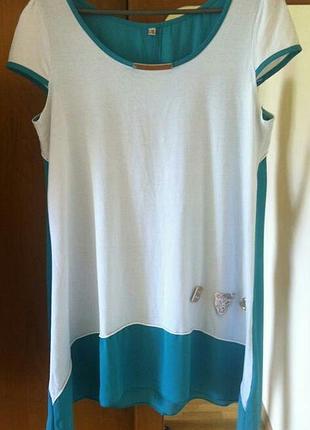 Красива оригінальна блузка изуирудного кольору