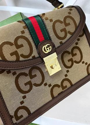 133258506 gucci kids gg supreme canvas changing bag 4000 Gucci Prince of Wales wool jumpsuit Grey