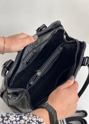 Черная деловая женская сумка на плечо из кожзам с двумя ручками и плечевым ремнем cilda tohetti.5 фото