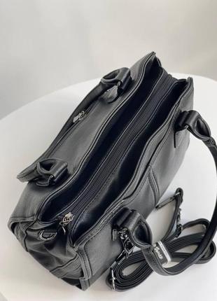 Черная деловая женская сумка на плечо из кожзам с двумя ручками и плечевым ремнем cilda tohetti.2 фото
