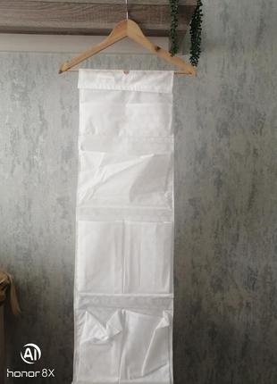 Органайзер полочка с карманами для одежды вещей ikea1 фото
