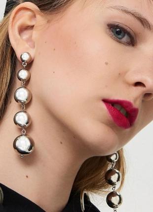 Cерьги  свисающие шарики серебристые