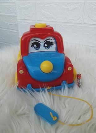 Машинка каталка "дружок" з рухомим капотом та дверима, що відкриваються