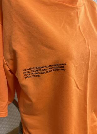 Костюм спортивный с шортами ярко-помаранчового цвета.5 фото