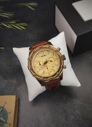 Чоловічий класичний наручний годинник skmei золотий2 фото