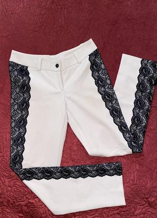 Дизайнерские брюки с ажурными вставками по бокам от андре тана5 фото