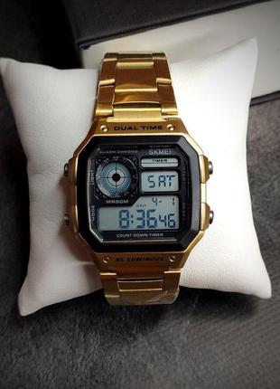 Чоловічий наручний годинник skmei цифровий золотий1 фото