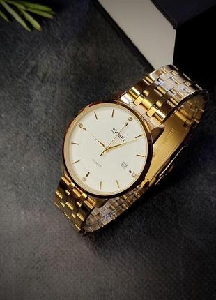 Чоловічий класичний наручний годинник skmei золотий2 фото