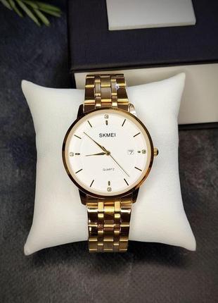 Чоловічий класичний наручний годинник skmei золотий1 фото
