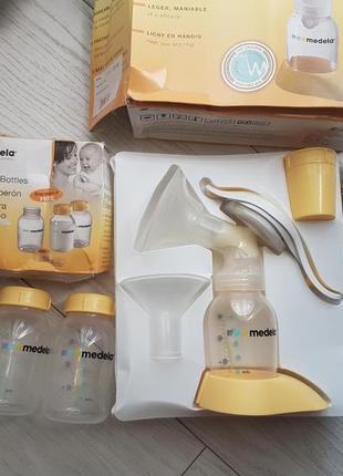 Ручной молокоотсос meleda и набор бутылочхек для сбора и хранения молока3 фото