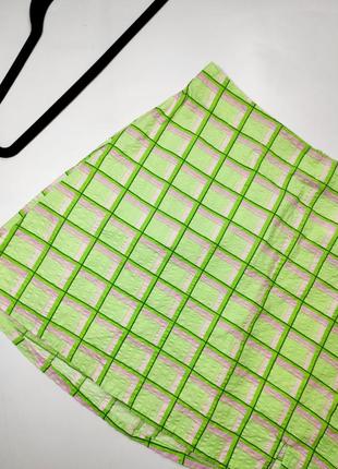 Спідниця жіноча міні салатового кольору в клітинку від бренду primark 8/122 фото