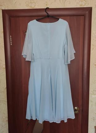Нарядна сукня блакитна міді10 фото