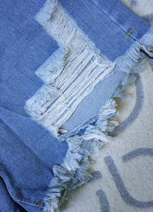 Женские джинсовые шорты с рваными краями голубые м4 фото