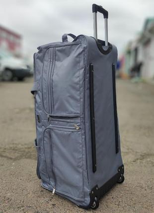 Удобная дорожная сумка мужская на колёсах прочная плотная тканевая сумка на колесах для командировок8 фото