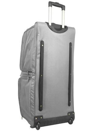 Удобная дорожная сумка мужская на колёсах прочная плотная тканевая сумка на колесах для командировок1 фото