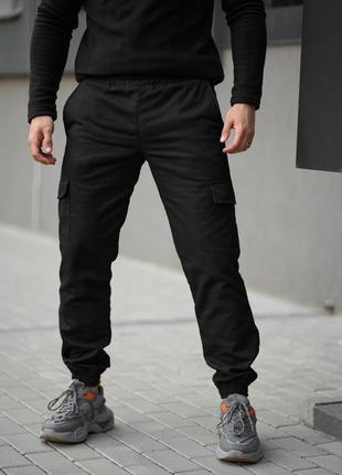 Теплі штани карго на флісі з кишенями чорні8 фото
