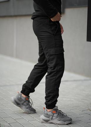 Теплі штани карго на флісі з кишенями чорні7 фото