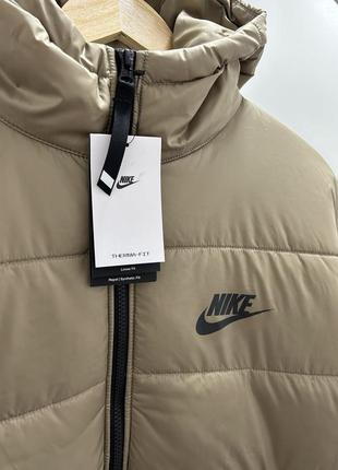 Женская оливковая куртка пуховик nike оригинал3 фото