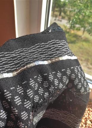 Черная,трикотажная мини юбка, обшитая пайетками5 фото
