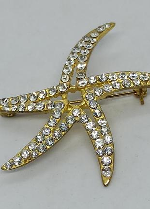 Брошка морская звёздочка из золотистого металла с камнями