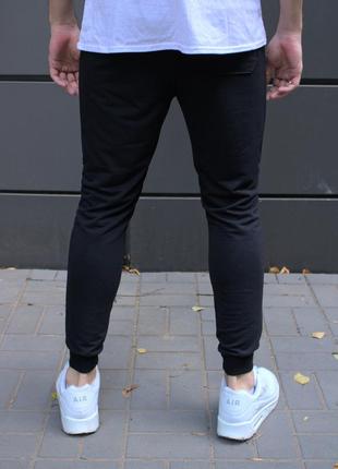 Чорні спортивні штани на манжетах8 фото