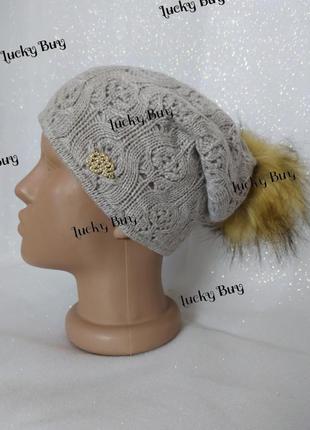 Женская шапка с бубоном
