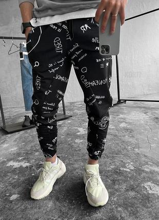 Спортивные штаны с принтами черные7 фото