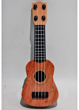 Игрушечная пластиковая гитара светло-коричневая2 фото