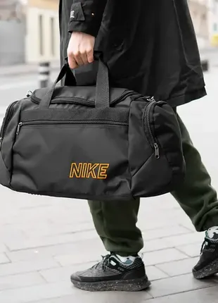 Стильна спортивна сумка nike oranje текстильна чорна для спортзалу/сумка для подорожей1 фото