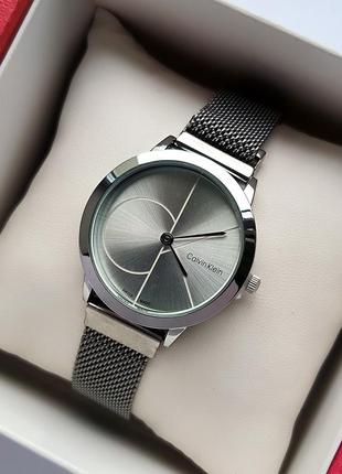 Жіночий сріблястий годинник на плетеному браслеті з магнітною застібкою