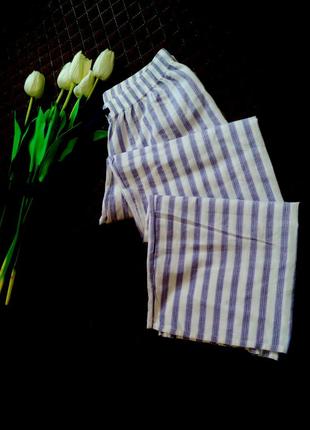 Домашні вільні штанці в фіолетово-бузкову смужку з мерехтливою ниткою.