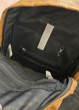 Оранжевый терракотовый рюкзак кемел с черным лого с черными деталями искусственная кожа пыльник в комплекте10 фото