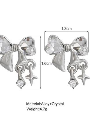 Серьги бантики с розовым камнем в стиле y2k3 фото
