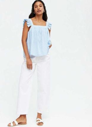 Стильная легкая блуза свободного кроя в клетку с крылышками new look