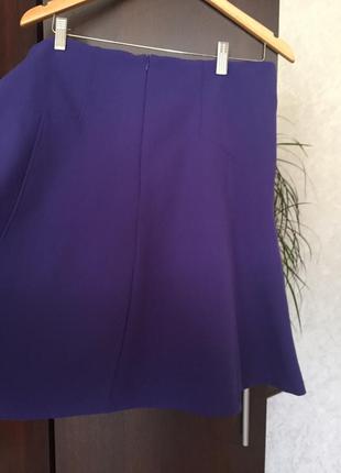 Расклешенная сиреневая юбка  с карманами4 фото