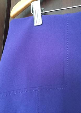 Расклешенная сиреневая юбка  с карманами5 фото