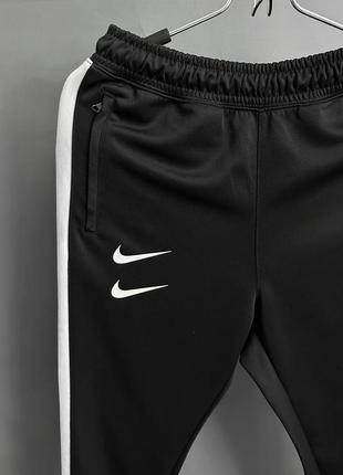 Спортивні штани nike swoosh3 фото