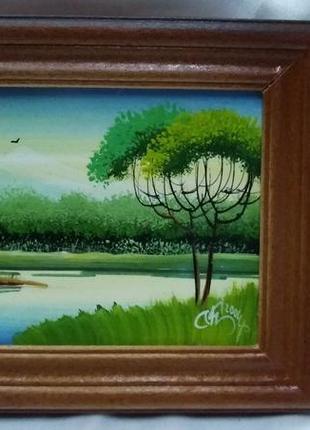Картина маслом в дерев'яній рамці.