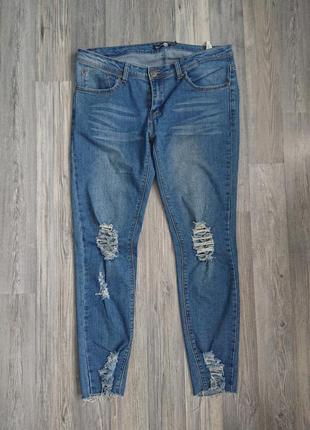 Женские джинсы с разрезами и необработанным краем р.44 /462 фото