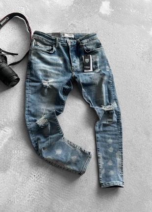 Синие джинсы мужские рваные1 фото