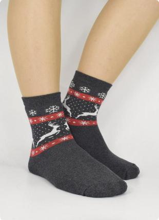 Консервированные новогодние носочки на год быка с дедом морозом и мешком5 фото